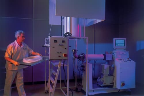 Man loading items into a machine